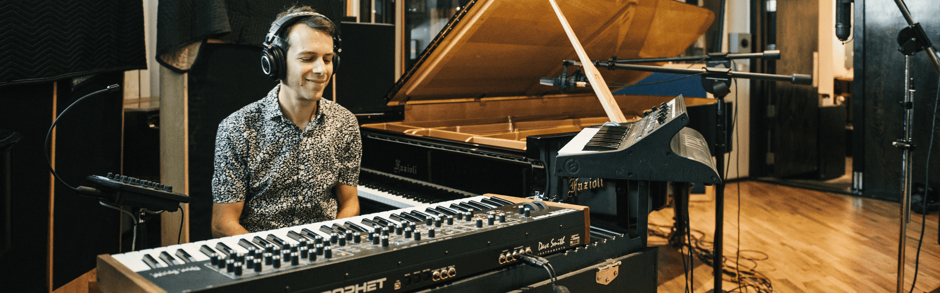 Image of musician Jesse Fischer at the Fender Rhodes in a recording studio